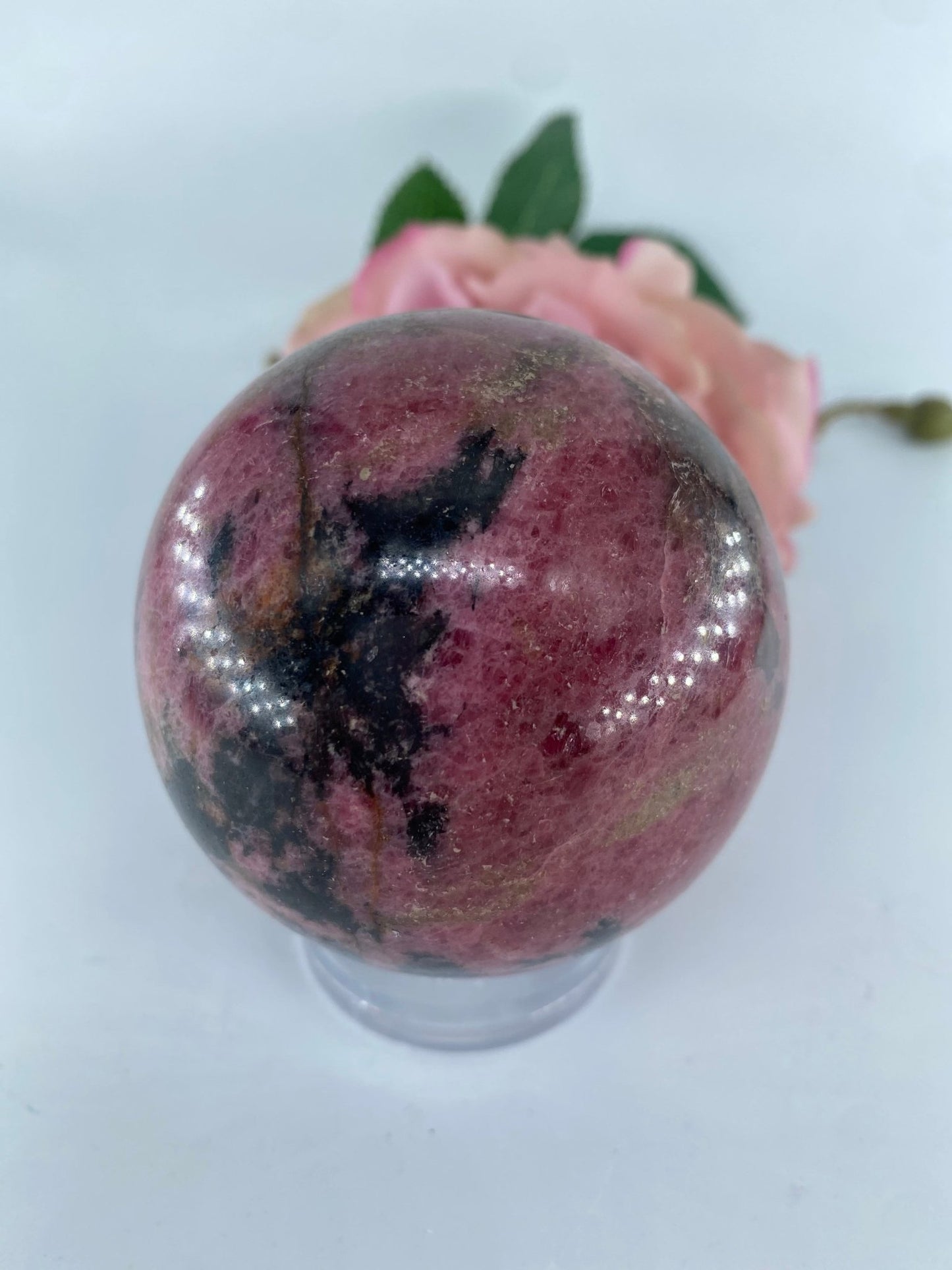 Polished Rhodonite Sphere 650 grams featuring pink tone with black veining - Positive Faith Hope Love