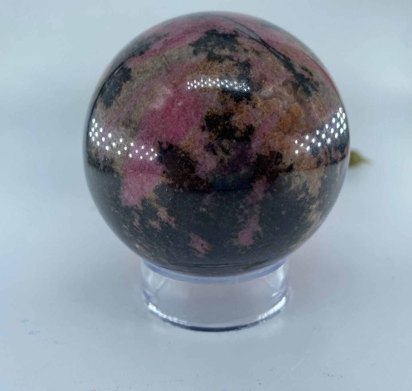 Polished Rhodonite Sphere 693 grams featuring pink tone with black veining - Positive Faith Hope Love