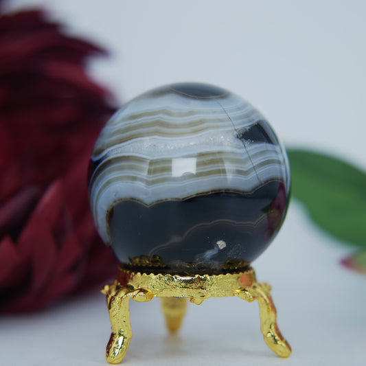 Polished Black And White Agate Sulemani Sphere 130G 45Mm 123459439 27 featuring banded patterns and glossy finish - Positive Faith Hope Love
