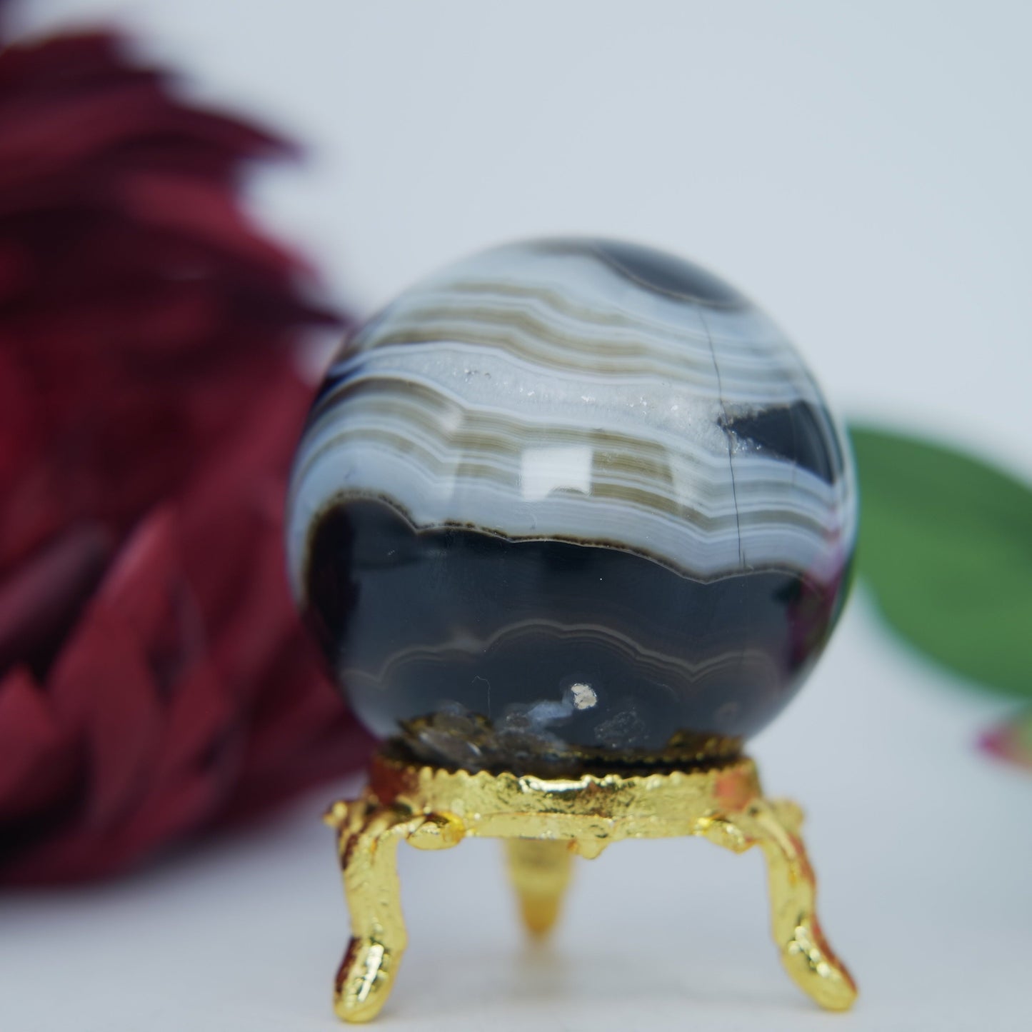 Polished Black And White Agate Sulemani Sphere 130G 45Mm 123459439 27 featuring banded patterns and glossy finish - Positive Faith Hope Love