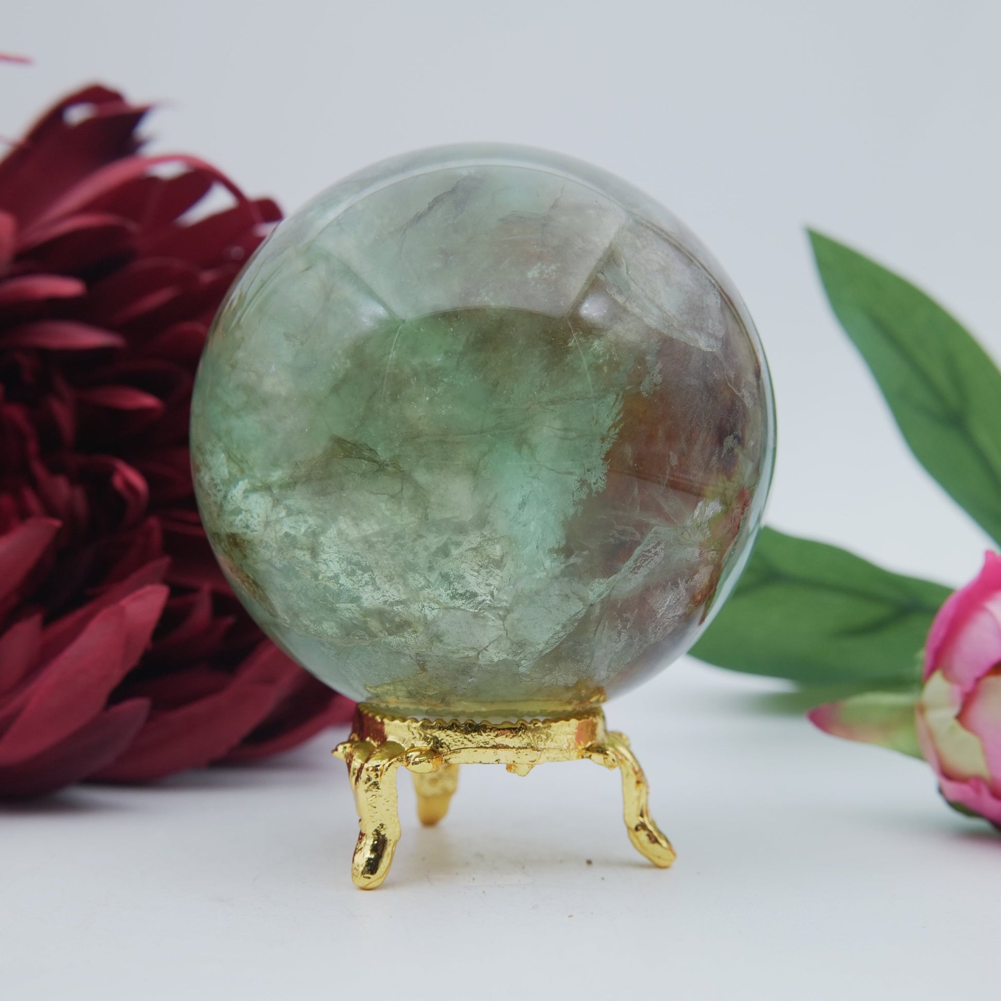 Polished Green Fluorite Sphere 630G 70Mm featuring banded green‑purple hues and glassy clarity - Positive Faith Hope Love