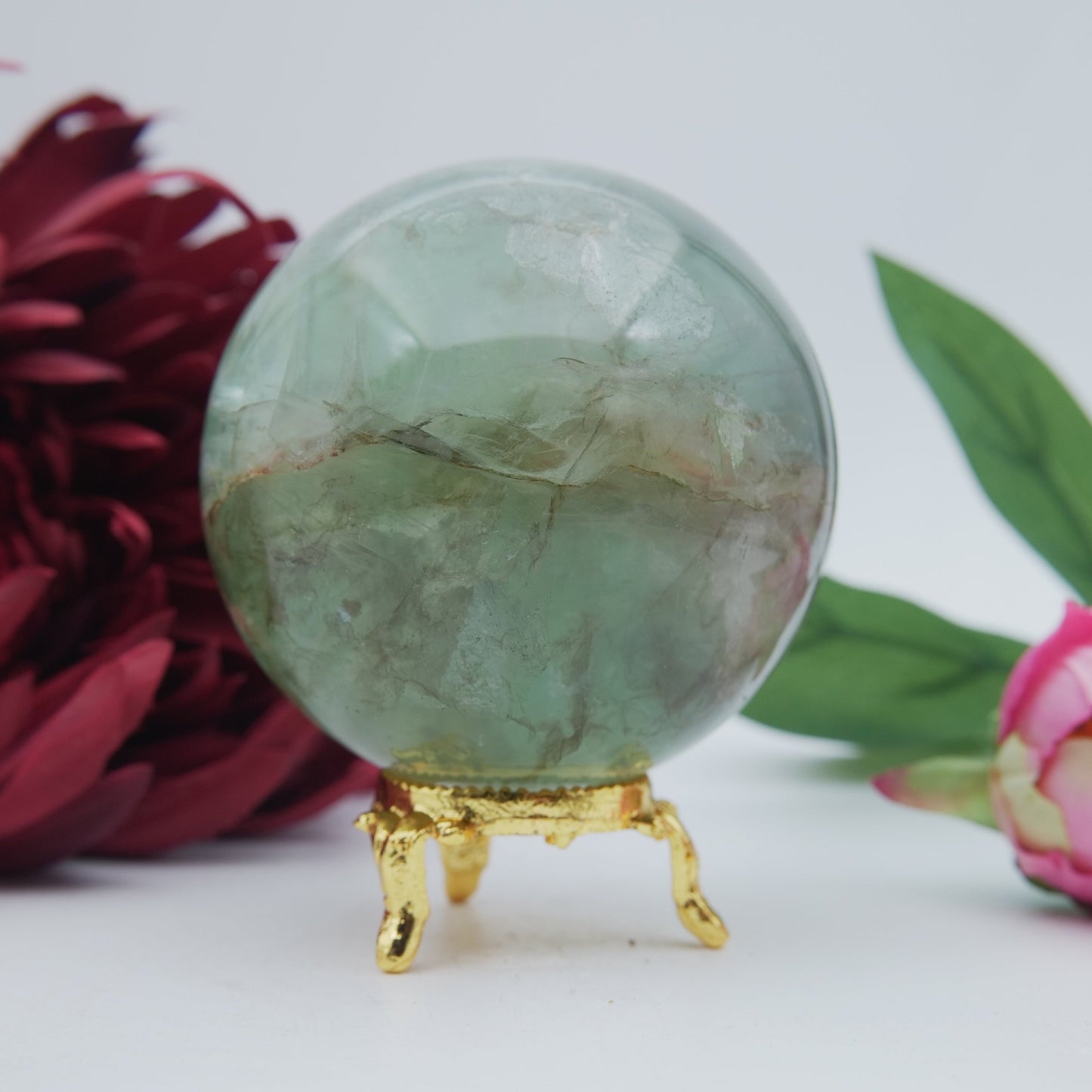 Polished Green Fluorite Sphere 630G 70Mm featuring banded green‑purple hues and glassy clarity - Positive Faith Hope Love