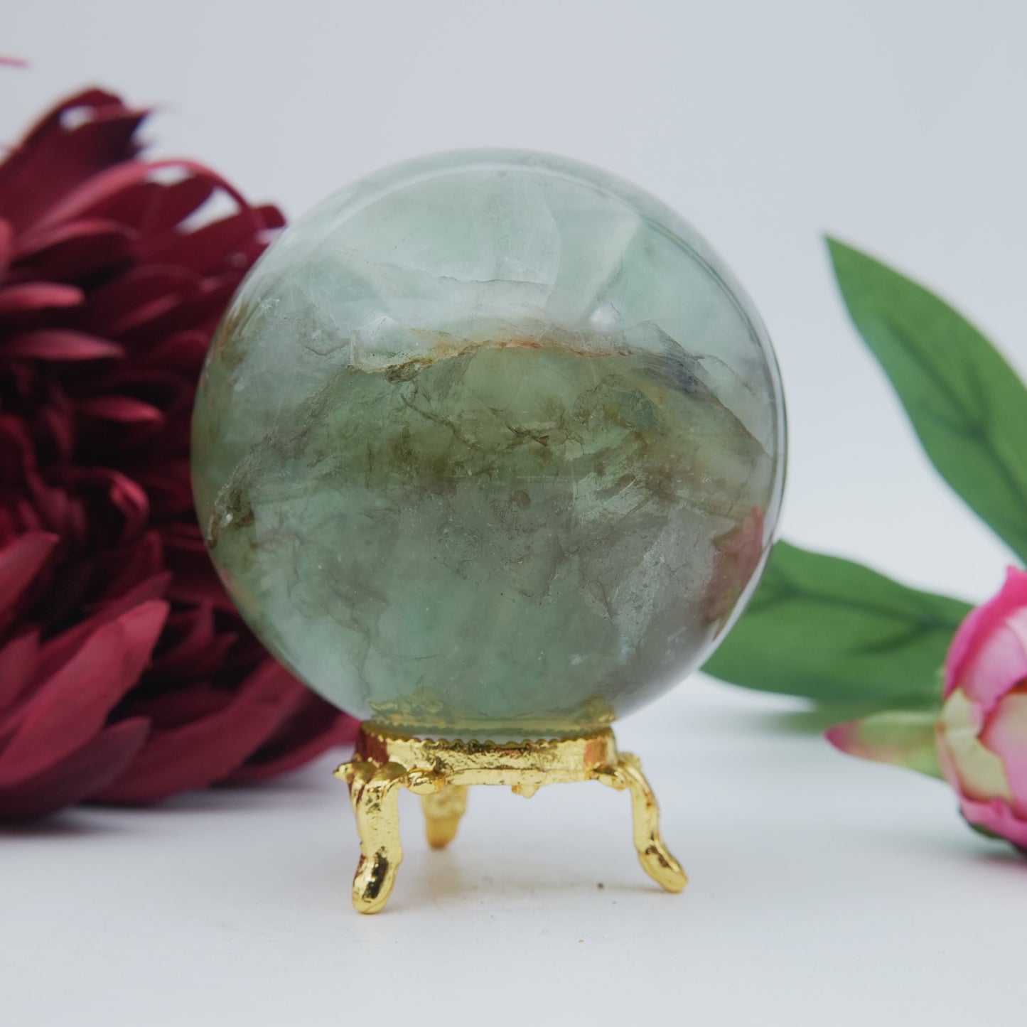 Polished Green Fluorite Sphere 630G 70Mm featuring banded green‑purple hues and glassy clarity - Positive Faith Hope Love