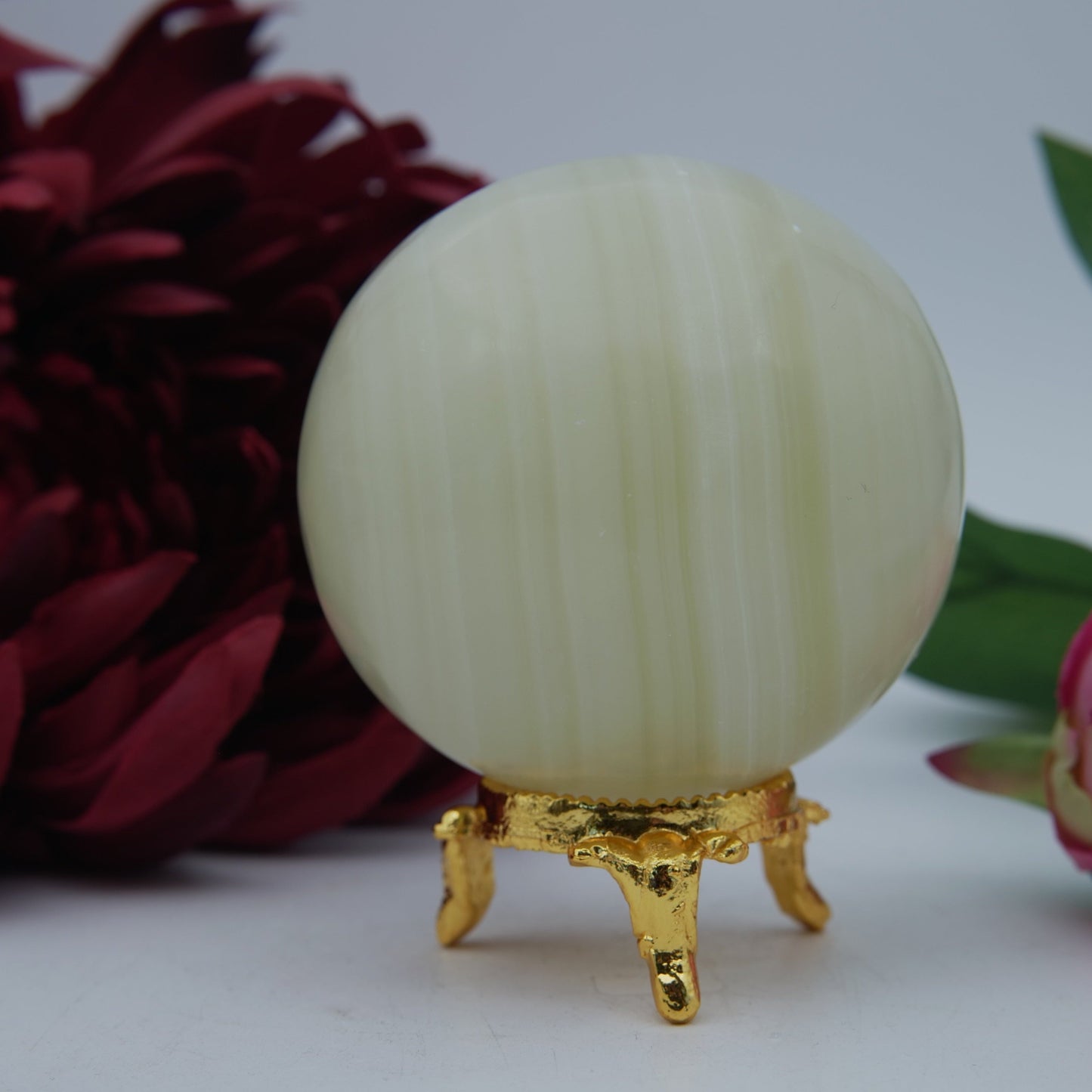 Polished Onyx Sphere 382g 65mm featuring natural patterning and unique variations - Positive Faith Hope Love