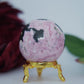 Polished Rhodochrosite Sphere 190G featuring pink bands and glassy finish - Positive Faith Hope Love