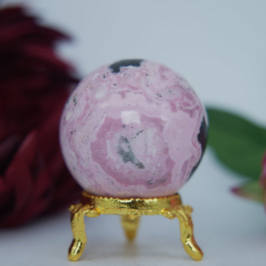 Polished Rhodochrosite Sphere 190g featuring pink bands and glassy finish - Positive Faith Hope Love