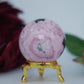 Polished Rhodochrosite Sphere 190g featuring pink bands and glassy finish - Positive Faith Hope Love