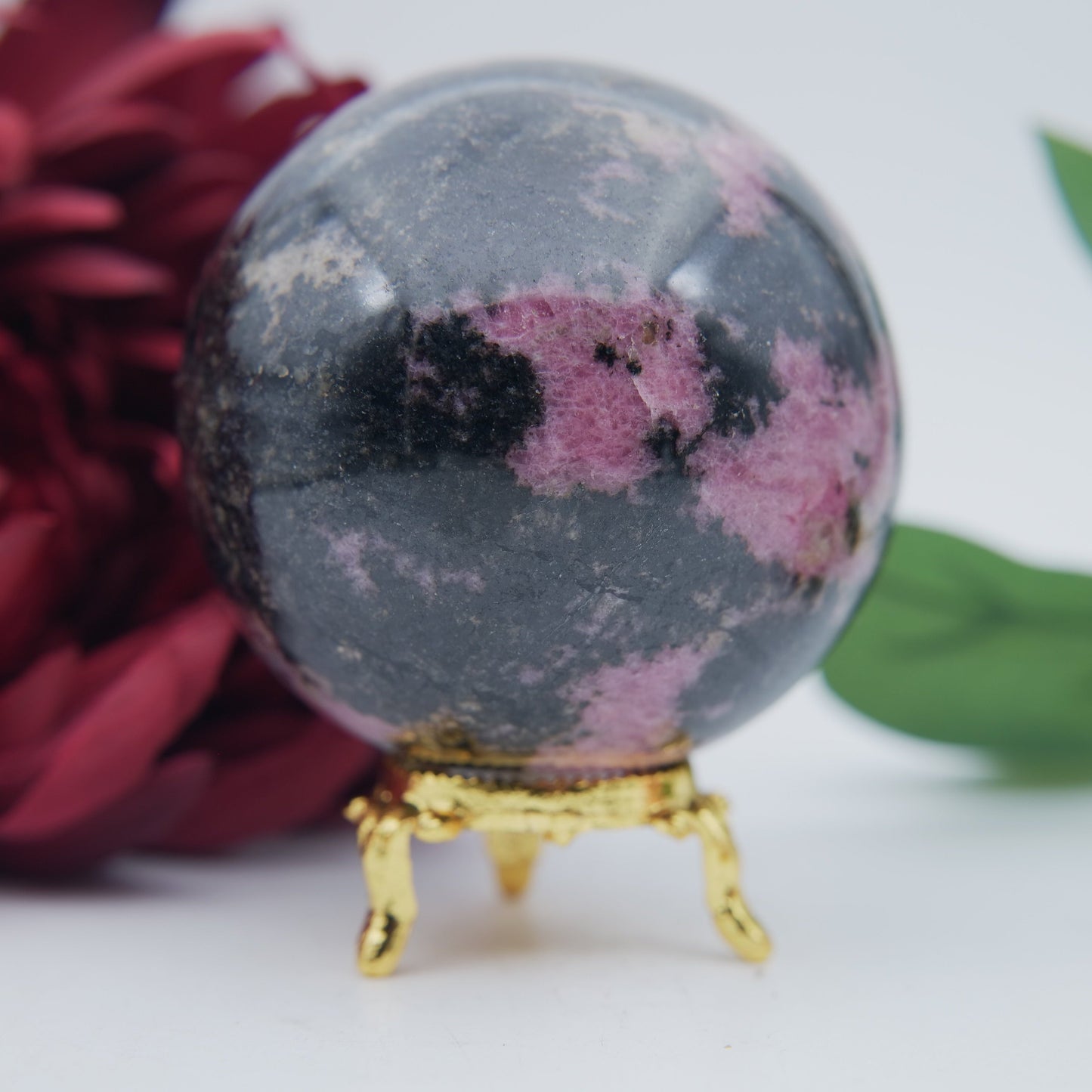 Polished Rhodonite Sphere Madagascar 693g featuring pink tone with black veining - Positive Faith Hope Love