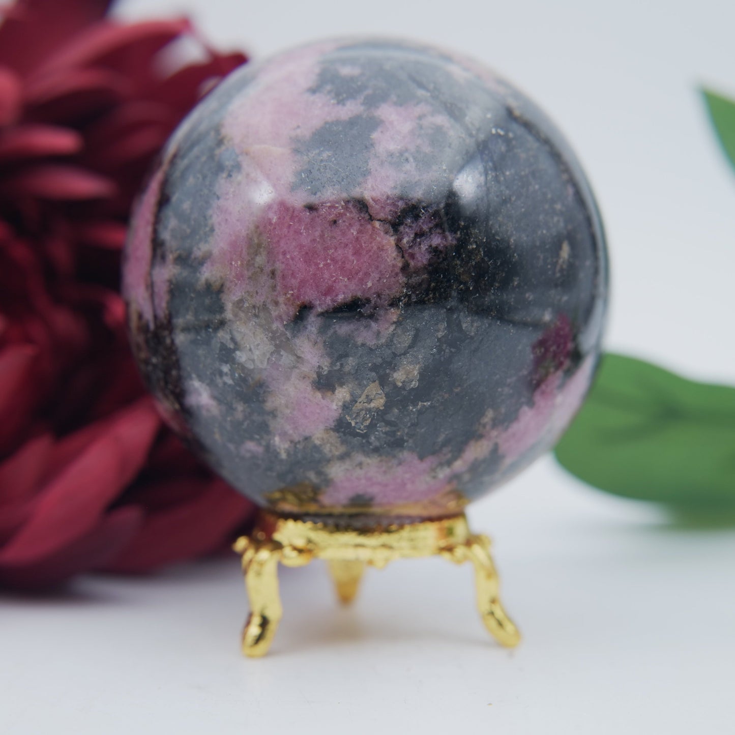 Polished Rhodonite Sphere Madagascar 693G featuring pink tone with black veining - Positive Faith Hope Love