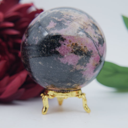 Polished Rhodonite Sphere Madagascar 693G featuring pink tone with black veining - Positive Faith Hope Love