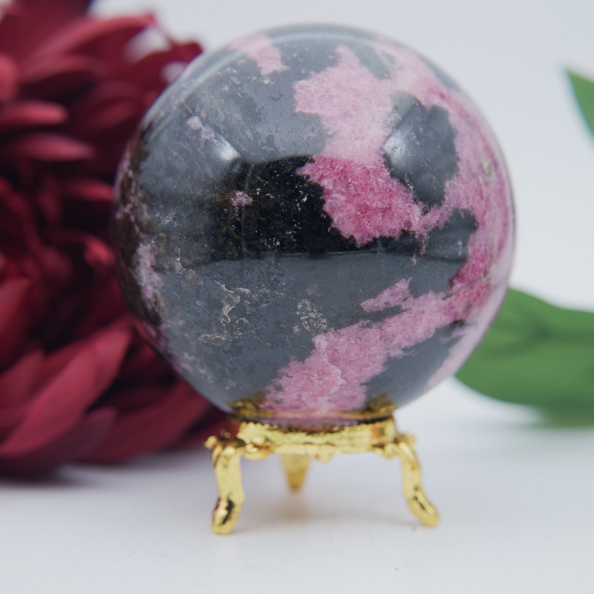 Polished Rhodonite Sphere Madagascar 712G featuring pink tone with black veining - Positive Faith Hope Love