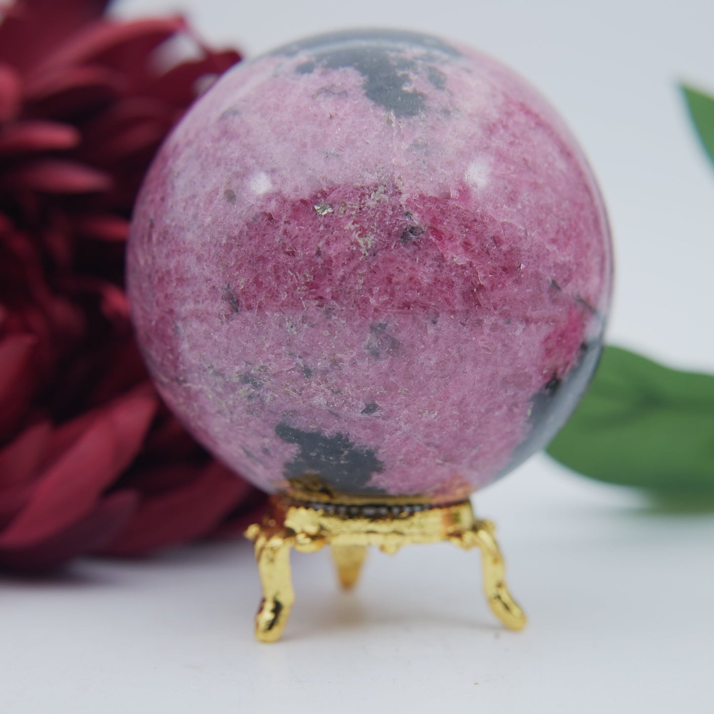 Polished Rhodonite Sphere Madagascar 712G featuring pink tone with black veining - Positive Faith Hope Love