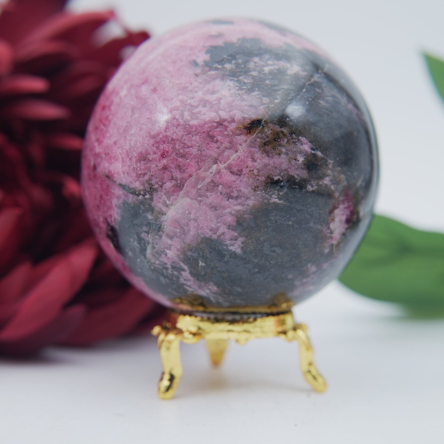 Polished Rhodonite Sphere Madagascar 712G featuring pink tone with black veining - Positive Faith Hope Love