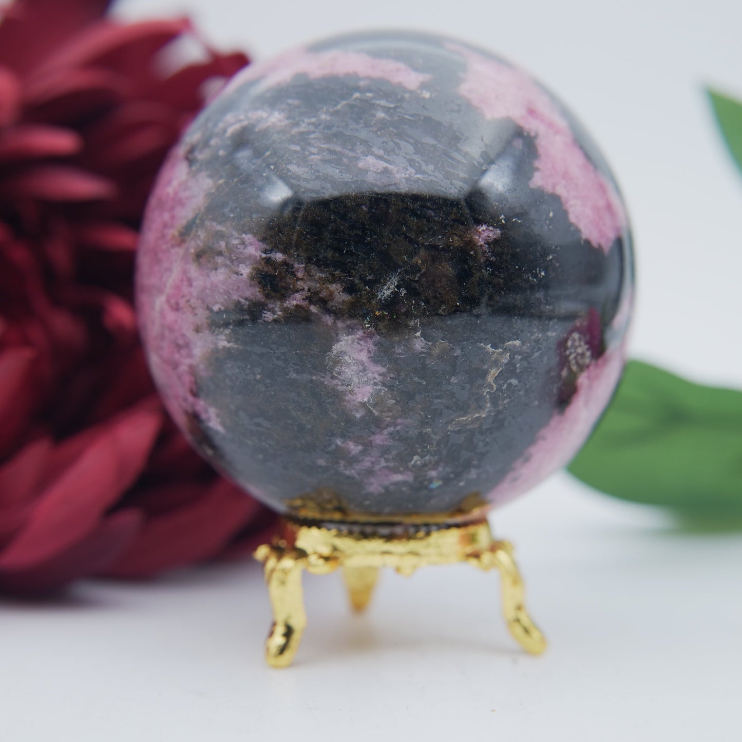 Polished Rhodonite Sphere Madagascar 712G featuring pink tone with black veining - Positive Faith Hope Love