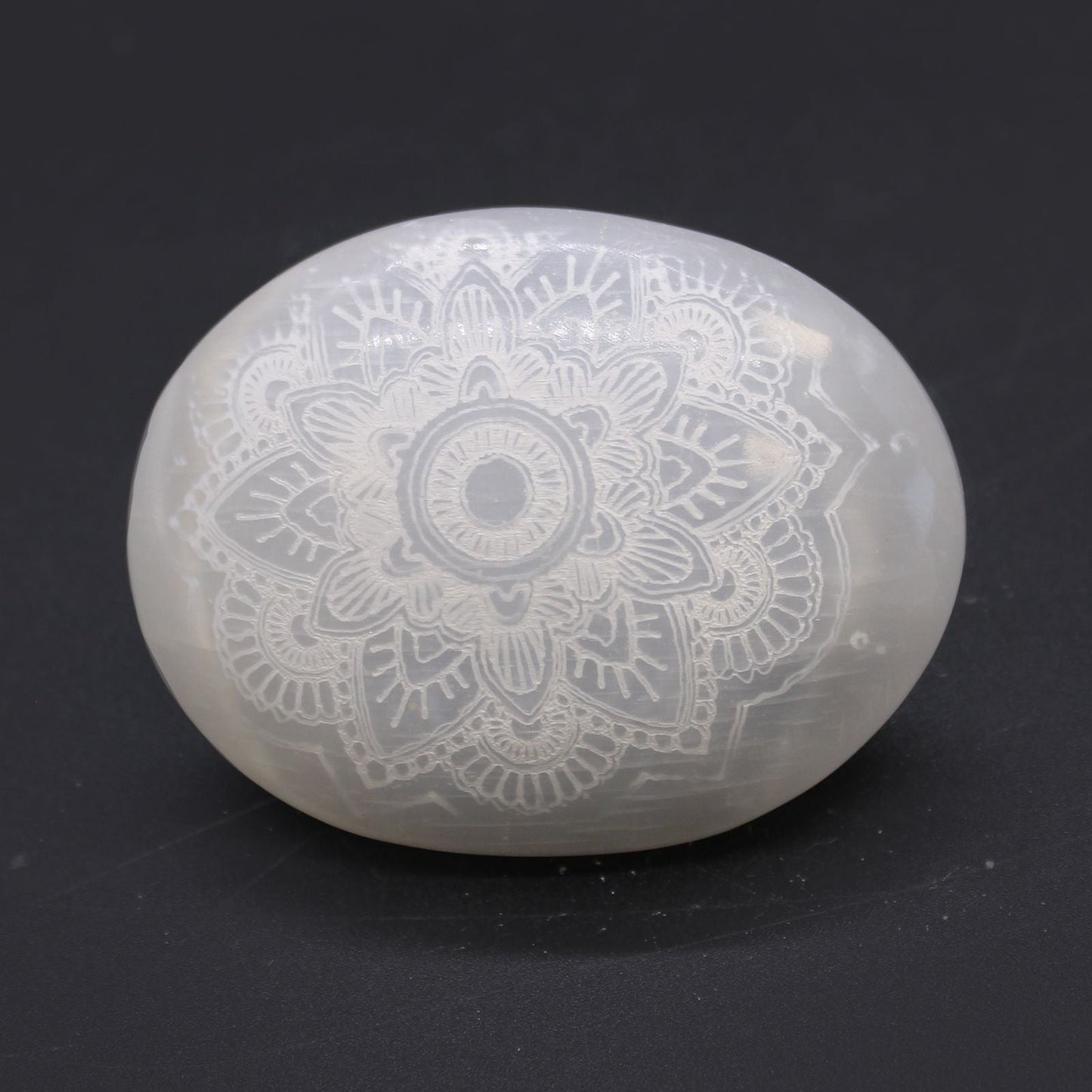 Polished Selenite Palm Stone Mandala Engraved featuring satin white sheen and fibrous texture - Positive Faith Hope Love