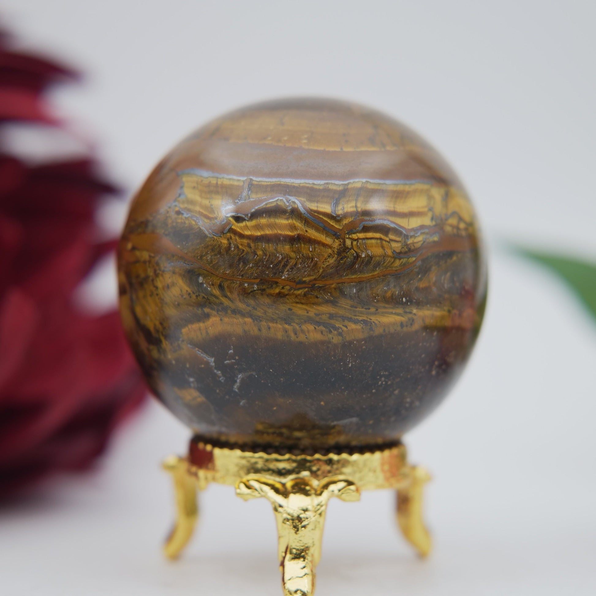 Polished Tiger Eye Sphere 210G 55M featuring natural patterning and unique variations - Positive Faith Hope Love