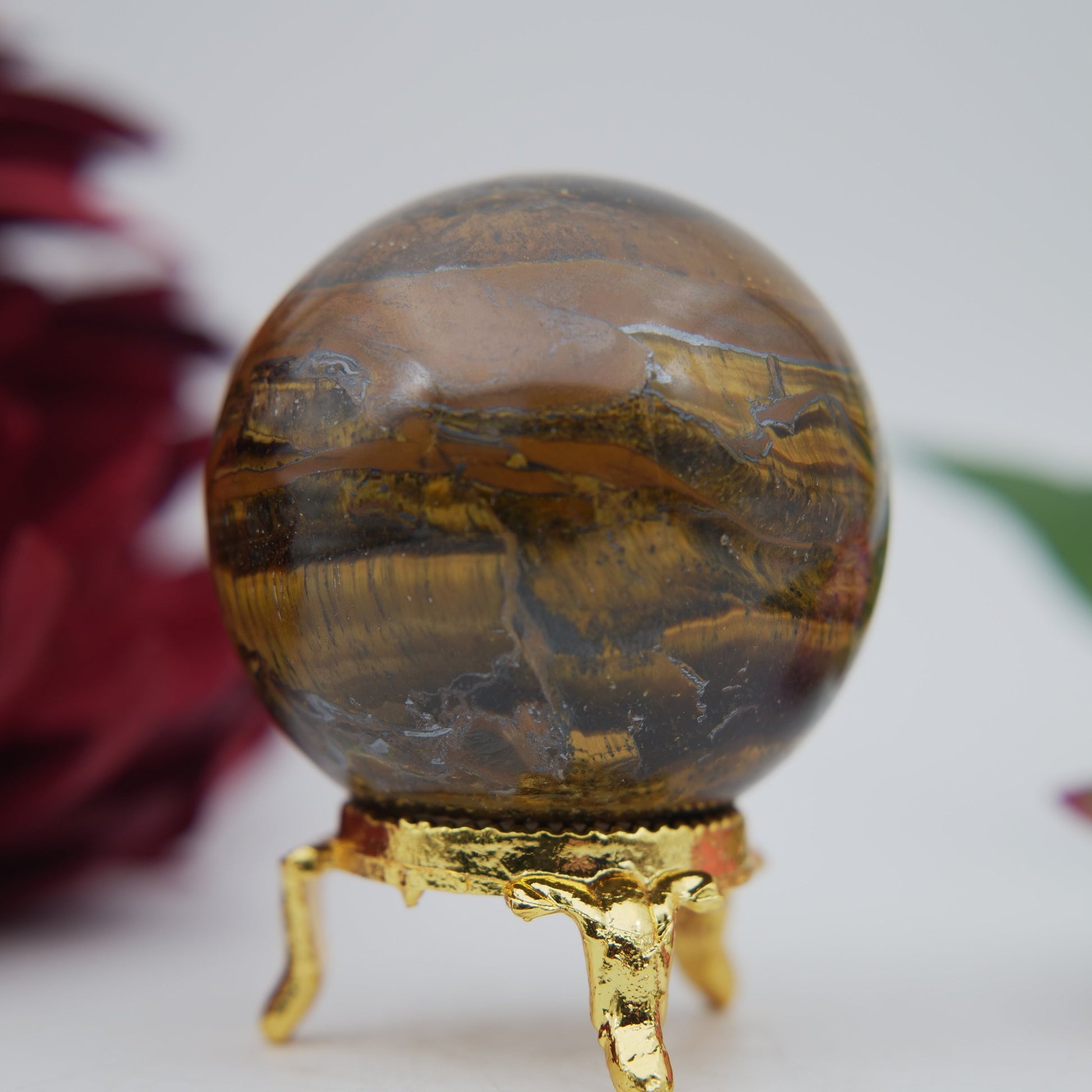 Polished Tigers Eye Sphere 210g 55mm featuring chatoyant golden-brown bands - Positive Faith Hope Love