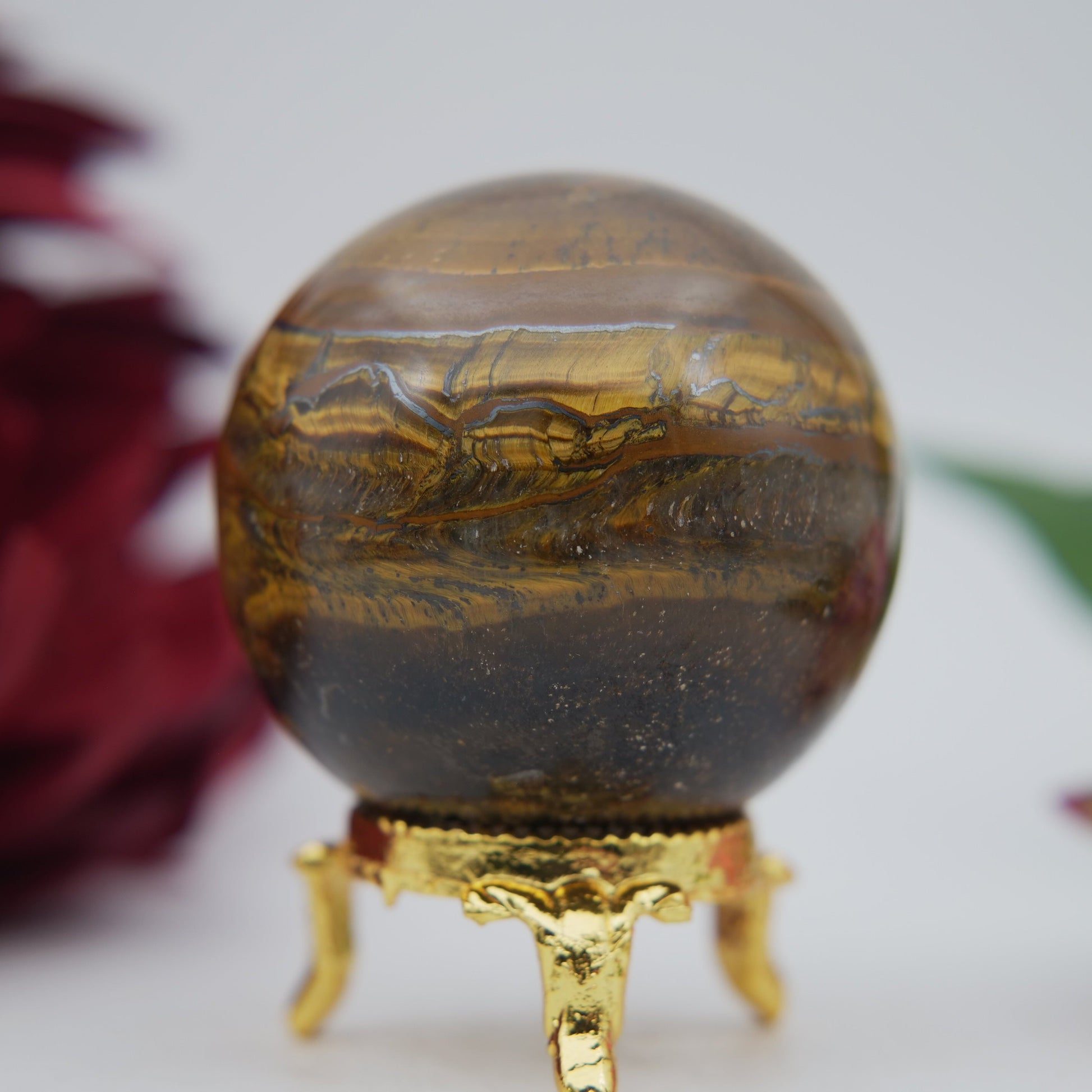 Polished Tiger Eye Sphere 210G 55M featuring natural patterning and unique variations - Positive Faith Hope Love