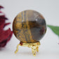 Polished Tigers Eye Sphere 215G 50Mm featuring chatoyant golden-brown bands - Positive Faith Hope Love