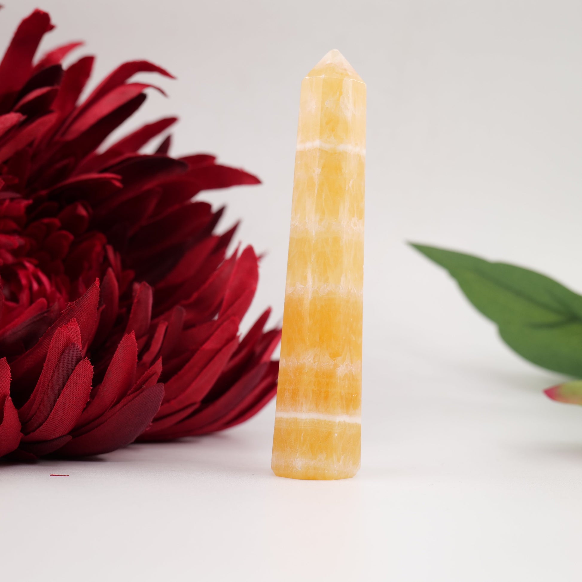 Polished Yellow Banded Mexican Calcite Tower 57G 100Mm featuring soft translucent tone and gentle sheen - Positive Faith Hope Love